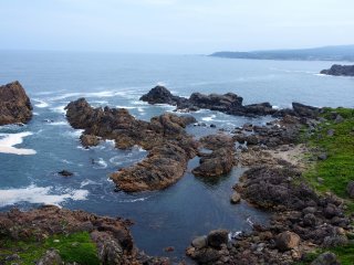 The rocks cluster in miniature archipelagos