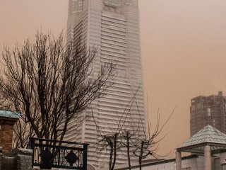 The sky's brownish color is actually red sand from China!