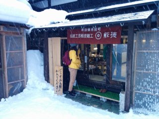 Escaping a sudden snow storm inside a local shop