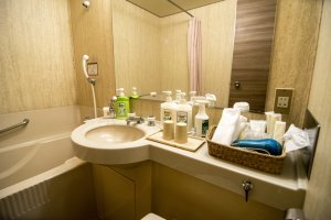 Various amenities are provided for your stay. In the bathroom, a basket full of everything you will need welcomes you to your room.