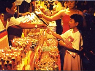 Little girl mesmerized by the shopkeeper