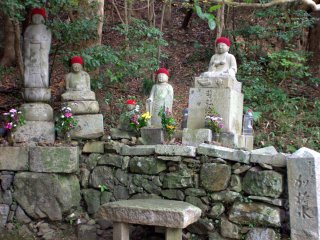 Buddhist statues on the side of the path