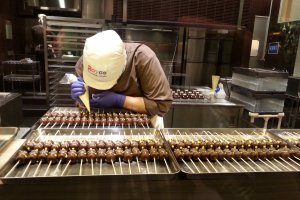 Each chocolate is given its finishing touches by hand