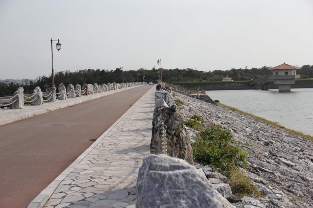 The road across Kurashiki Dam is picturesque along both sides and each end