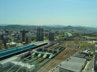 The east side of Morioka Station with mountains behind.