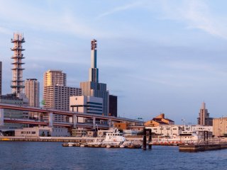 The city and port glow pleasantly as the sun sets, making this a great spot to check out the tall buildings of Kobe.