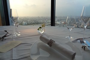 Crisp, clean table setting overlooking the city