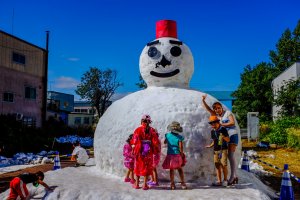 The giant snowman is a popular attraction at the summer festival