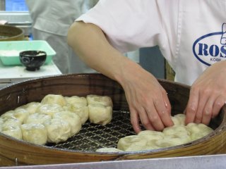The chefs at work, preparing delcious nikuman (steamed bun with meat filling)