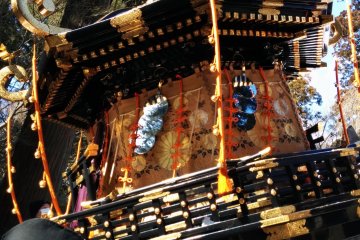 <p>A close up of the portable shrine. Notice the hanging mirrors.</p>