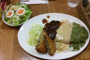 The triple katsumeshi, with white, red and green sauce, a croquette and a caesar salad, all delicious.