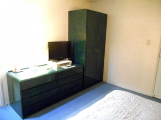 Desk and closet in bedroom