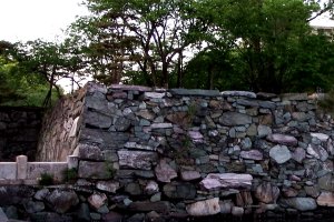 Colorful stone wall, with pink, blue, green-like color stones