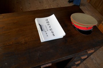 <p>Director&#39;s military cap and report about Japan-Germany War during World War I</p>