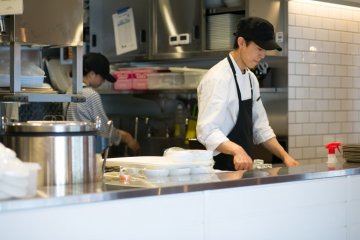 <p>The cafe&#39;s kitchen with their friendly staff</p>