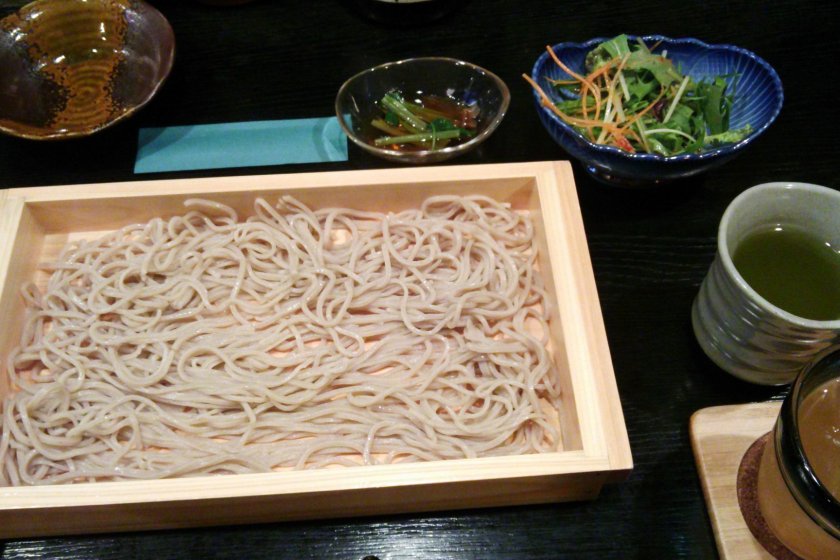 Simple but delicious handmade soba (buckwheat) noodles. As with most izakaya, there is an extra charge added to the bill, but you are served something to nibble on, in this case a salad.