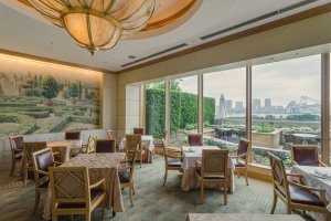 Large windows, wall murals and other features make for a pleasant atmosphere at Terrace On The Bay in the Hotel Nikko Tokyo.