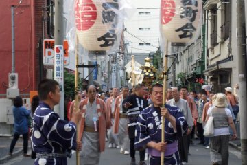 The beginning of the procession of one of the mikoshi.