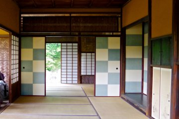 <p>These blue and white checked sliding doors inside the Shokin-tei teahouse symbolize a nearby waterfall</p>