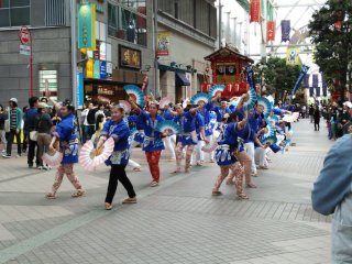Each group has slightly different choreography, costumes and colored fans.