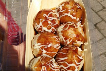 Dozens of food stalls sell all sorts of food. There&#39;s local food and festival food and takes on a favorite, like these quail&#39;s egg takoyaki.