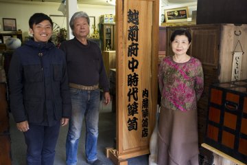 <p>Posing with Mr Yoshio and his wife outside his tansu shop</p>