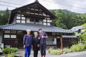<p>Posing with Mr and Mrs Kato outside their huge countryside house</p>