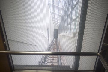 <p>Inside the lift that goes diagonally up and down between the onsen accommodation and the onsen itself</p>