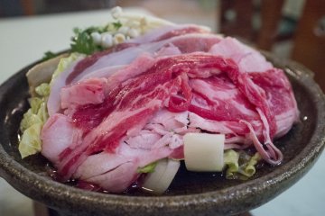 <p>The dinner course - sukiyaki consisting of succulent beef, cabbage and enoki mushrooms</p>