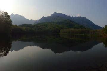 <p>The Togakushi Range, reflected on the still water of Kagami-ike.</p>