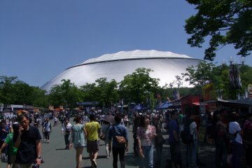 <p>Fans and vendors milling in front of the Seibu Dome</p>