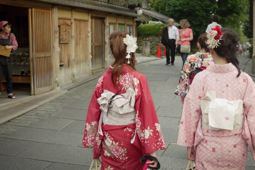 On the way to the temple, Japanese women dressed in their traditional kimono outfit.