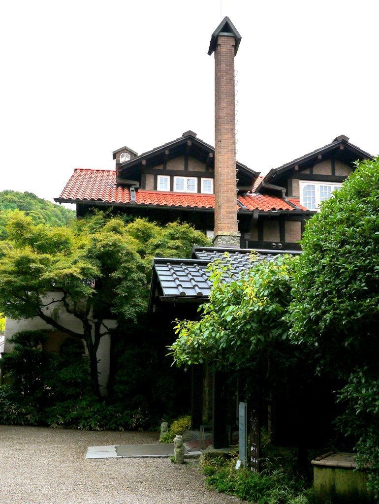 <p>The graceful main building with its tall chimney</p>