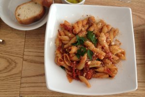 Tender pork and vegetable pasta (no mushrooms) with complimentary bread.