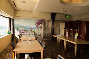 <p>Large murals stretch along the wall of the restaurant</p>