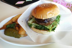 Teriyaki burger lunch set with chunky fries and a pickle