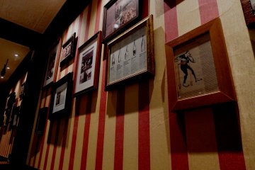 <p>Some retro-looking pictures and posters decorate the walls</p>