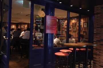 <p>At twilight, the pub becomes crowded with office workers relaxing after work</p>