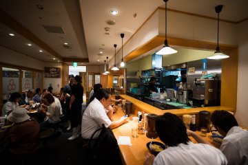 <p>How it looks like inside. Look at the amount of people just waiting/eating their ramen!</p>