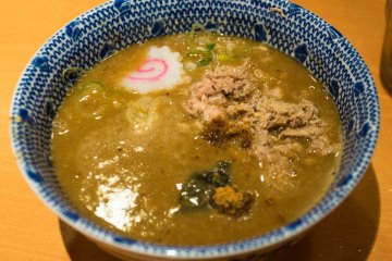 <p>The very rich and flavorful&nbsp;broth</p>