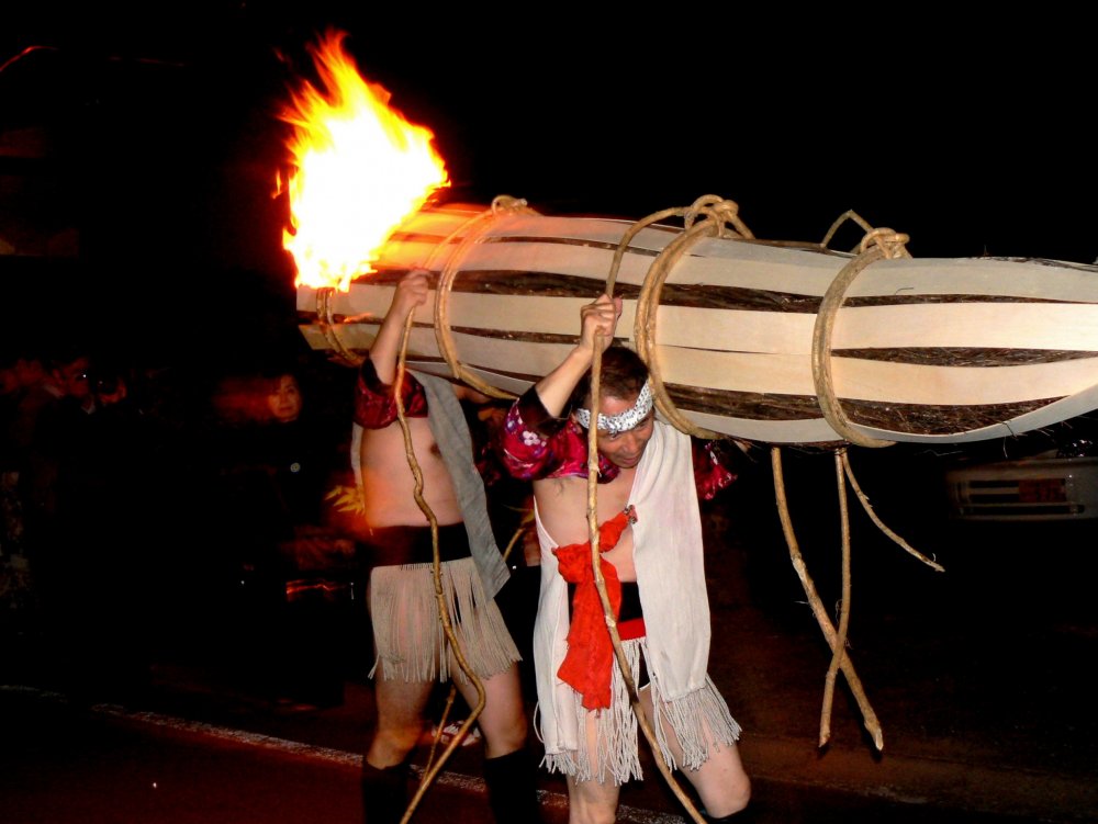 Some of the bigger torches require several men to carry them