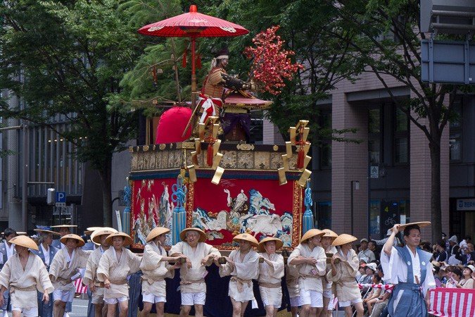 <p>Houshou-yama (保昌山) During the Yamaboko Junko (山鉾巡行) in Kyoto,2012! This float features the famous love story between court poetess Izumi Shikibu and courtier Hirai Yasumasa. In the scene portrayed on this float the valiant Yasumasa, also called Hosho, dares to intrude into the Shishin-den, the very center of the Imperial court, to snap a branch from a noted red Ume tree (Japanese plum) to present it to this court lady that he admires</p>