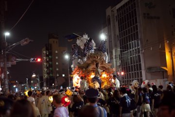 <p>One of the nine floats of the parade. Many of the participants chanted and danced while on the floats.</p>