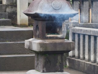 People pay their respect to the Akoroshi by burning incense sticks in the graveyard
