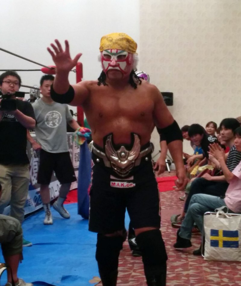 <p>The Great Sasuke retains the championship belt. He is very popular, partly because he throws candy to the children in the crowd before matches</p>