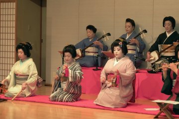 <p>Awara Geigi (Geisha) on stage. They can also play instruments like Shamisen (Japanese guitar with three strings, Tsuzumi (Japanese hand drum), and&nbsp; Taiko (drum)</p>