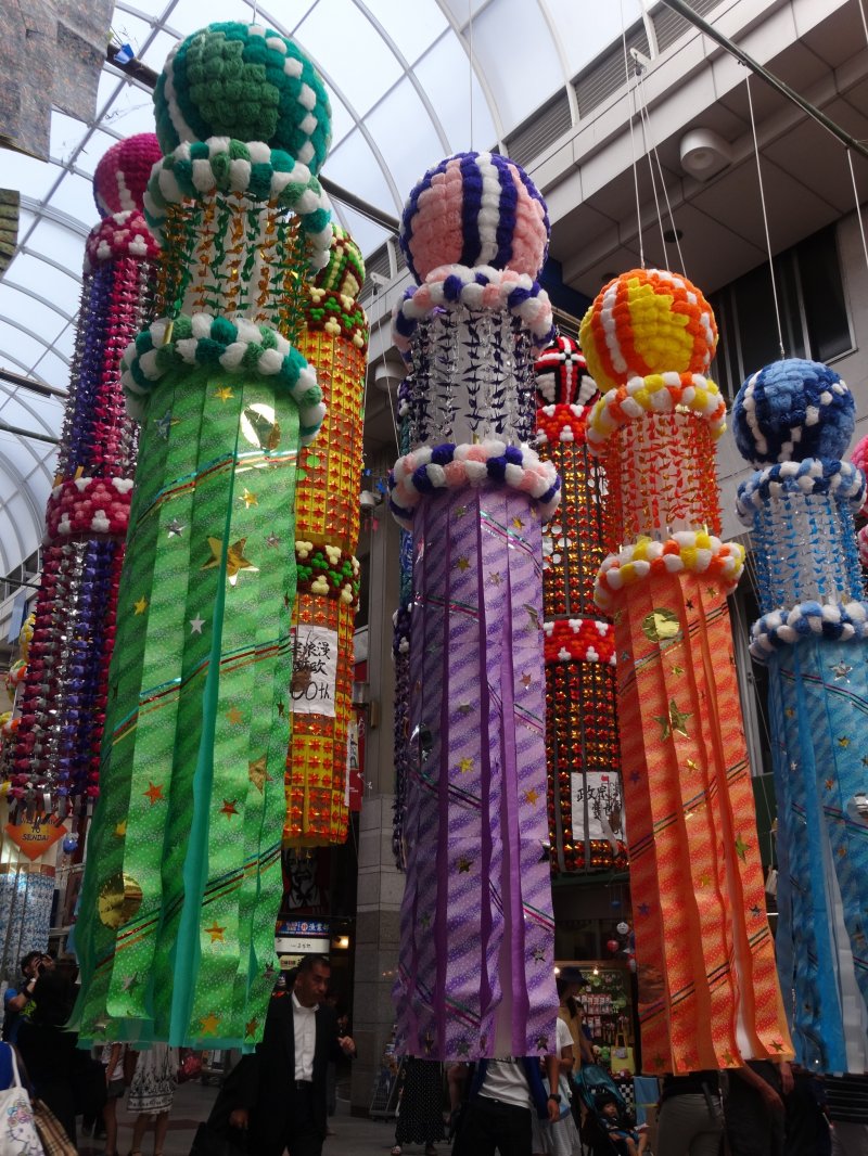 <p>Each group of streamers are decorated by various city shops, schools or civic organizations</p>