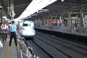 Passengers disembark the Shinkansen at Nagoya Station