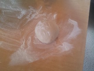 After a bit of kneading you can turn your ball of dough out onto the table.