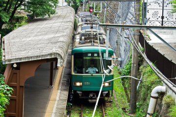 <p>A train pulling out of Gokurakuji Station. This train rides along the very nostalgic and scenic Enoden Railway Line</p>